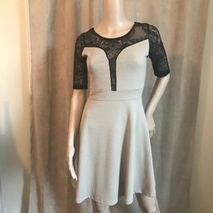 NWOT beige and black dress with lace accents.